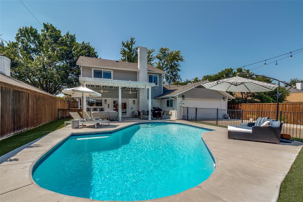 9243 Moss Farm Lane Dallas, TX 75243 - Photo 31 of 37 a view of a house with swimming pool and sitting area