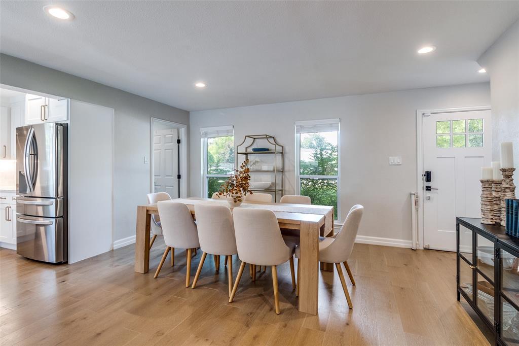 9243 Moss Farm Lane Dallas, TX 75243 - Photo 8 of 37 a view of a dining room with furniture window and wooden floor