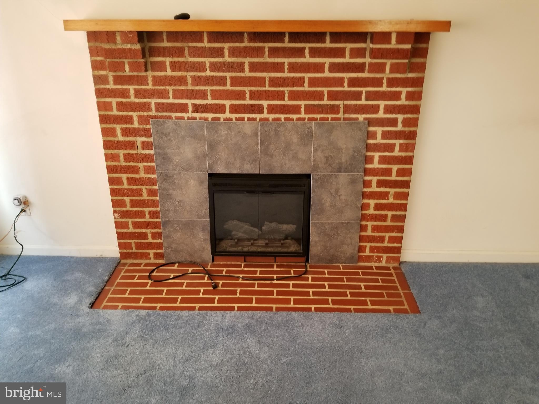 3800 New Section Road Middle River, MD 21220 - Photo 18 of 45 Brick Fireplace in Living Room