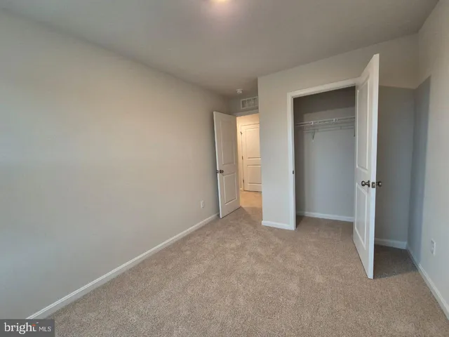 a kitchen with wooden floors and white appliances