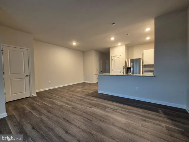 a view of a livingroom with wooden floor