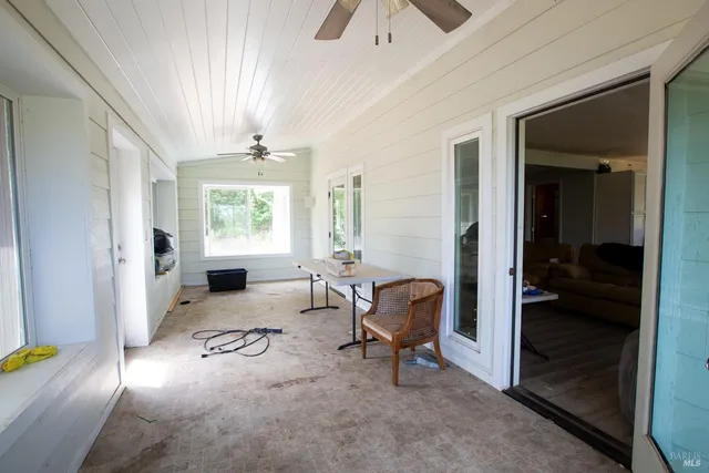 a view of a livingroom with furniture and windows