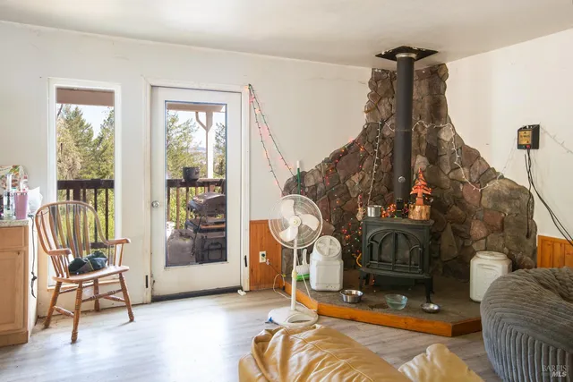 a living room with furniture and a floor to ceiling window
