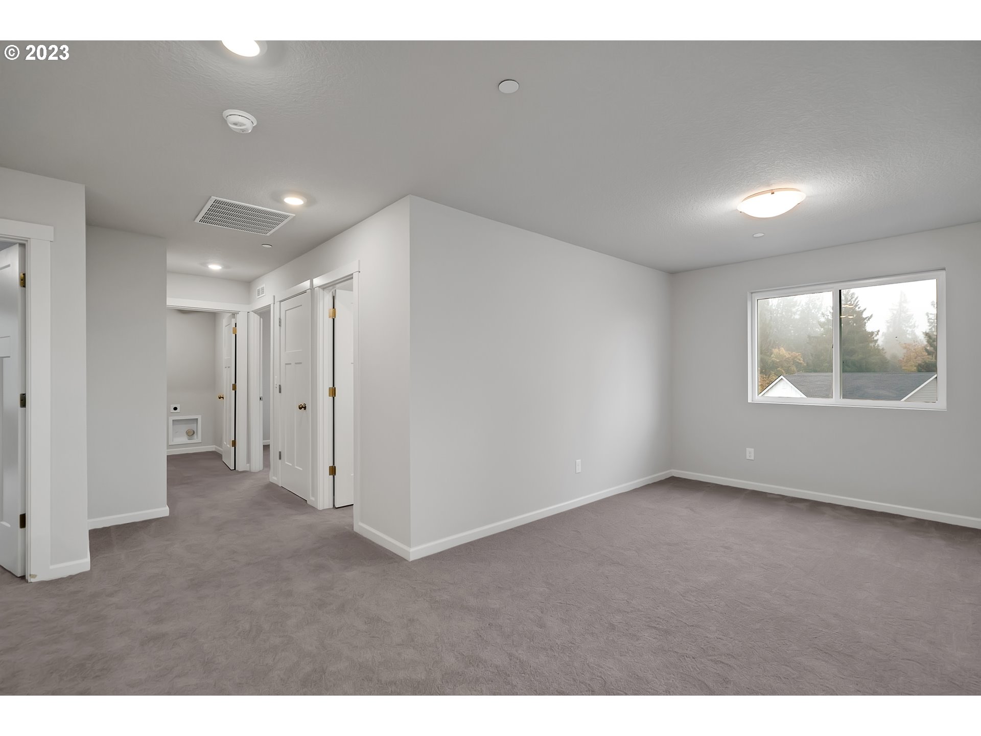 2632 South 8th Way Ridgefield, WA 98642 - Photo 18 of 28 a view of an empty room with a window