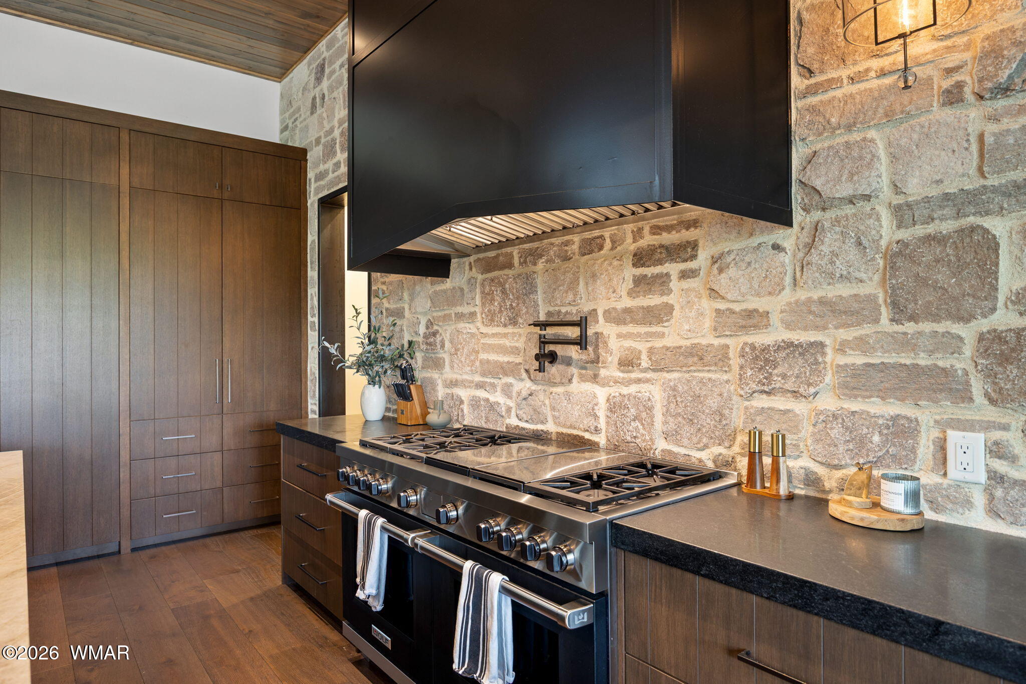 2441 South Monkshood Road Show Low, AZ 85901 - Photo 20 of 90 a kitchen with a stove and a wooden cabinets