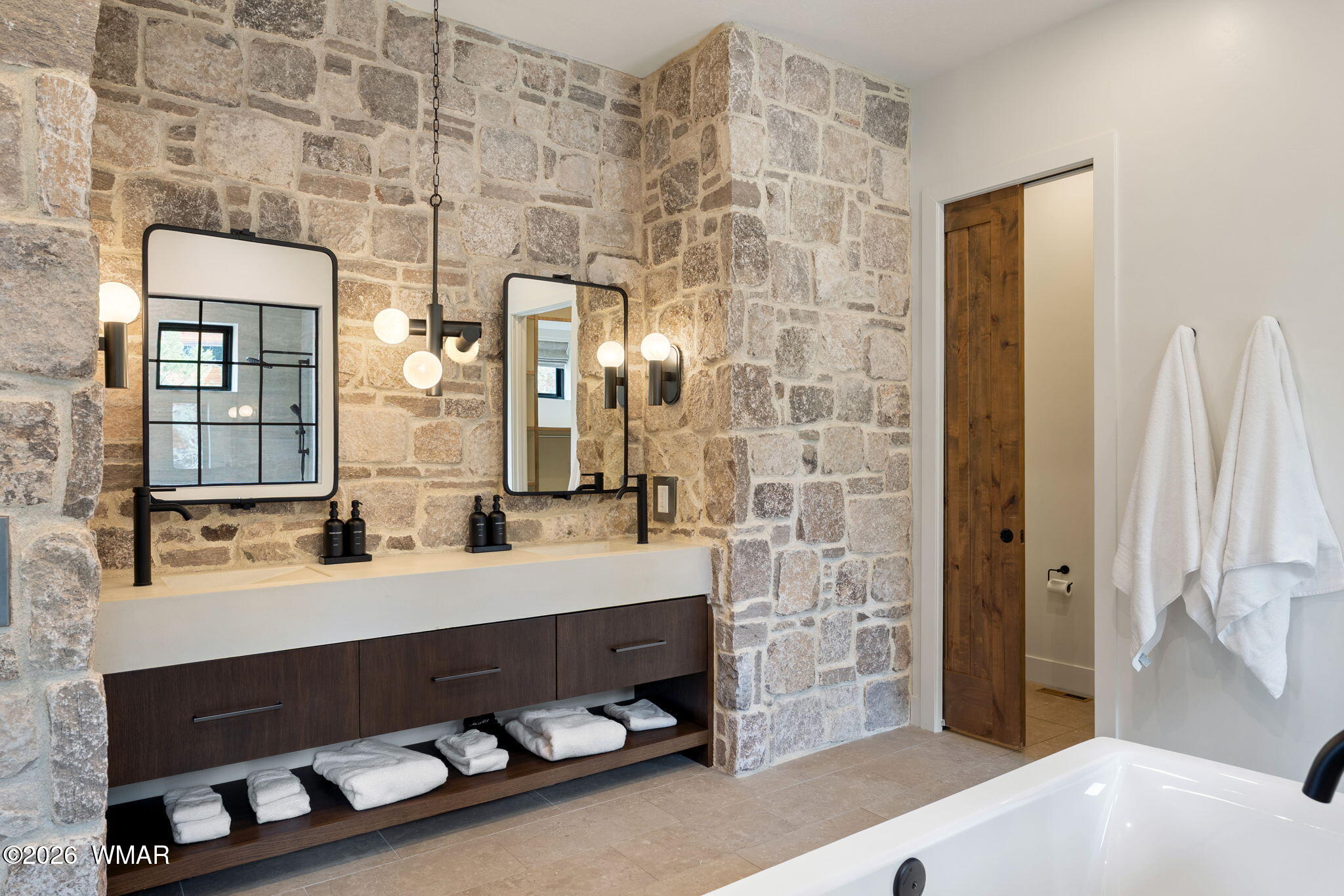 2441 South Monkshood Road Show Low, AZ 85901 - Photo 30 of 90 a bathroom with a double vanity sink a mirror and bathtub