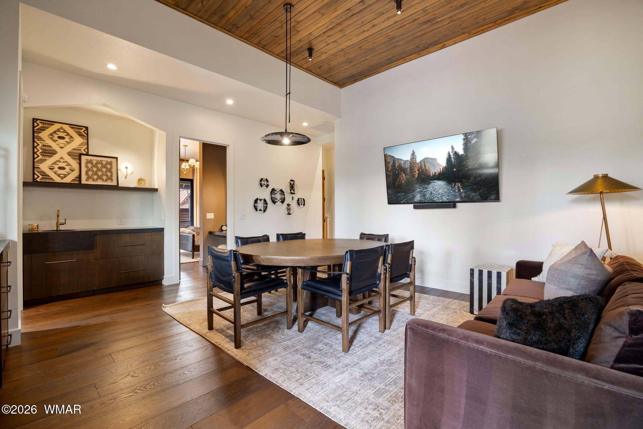2441 South Monkshood Road Show Low, AZ 85901 - Photo 45 of 90 a view of a dining room with furniture and wooden floor