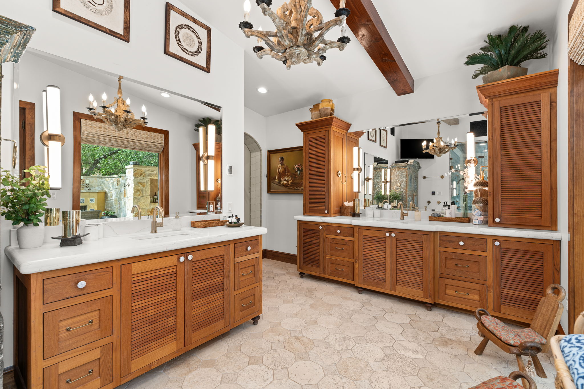 11941 Overlook Pass Austin, TX 78738 - Photo 16 of 40 Spacious vanity area featuring multiple wood-finish cabinetry, white countertops, and full-wall mirrors