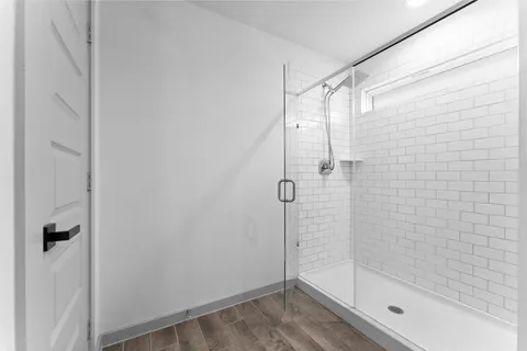 a view of walk in closet with clothes