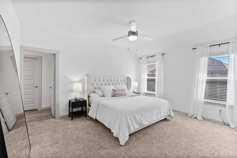 a kitchen with stainless steel appliances granite countertop a dining table chairs stove refrigerator and cabinets