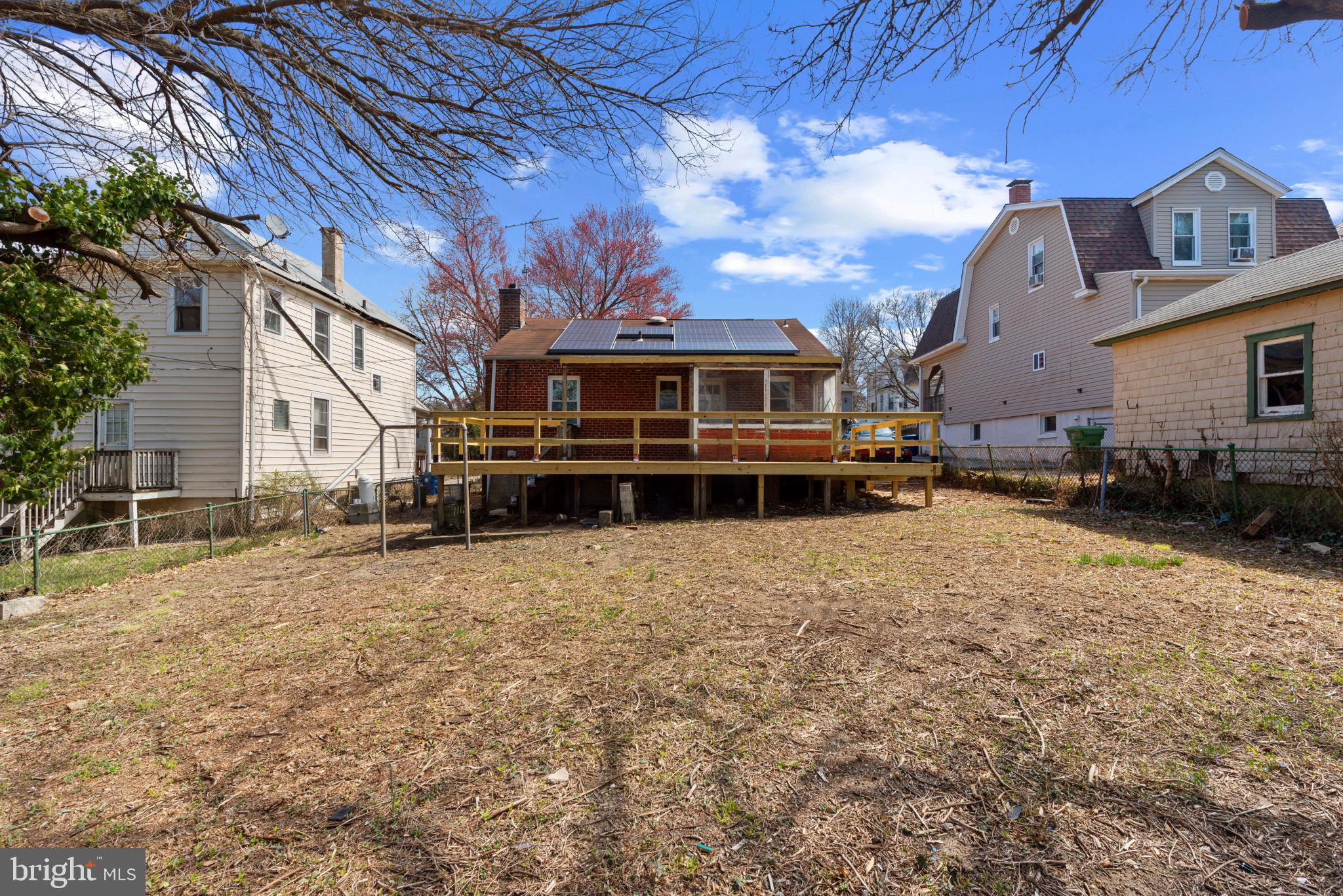 5016 Morello Road Baltimore, MD 21214 - Photo 12 of 16 a view of a house with a yard