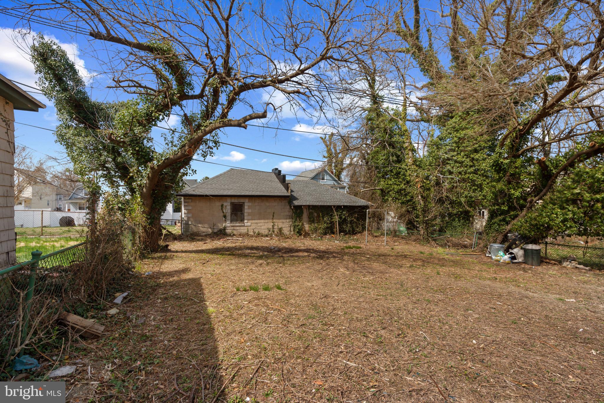 5016 Morello Road Baltimore, MD 21214 - Photo 14 of 16 a front view of a house with a yard