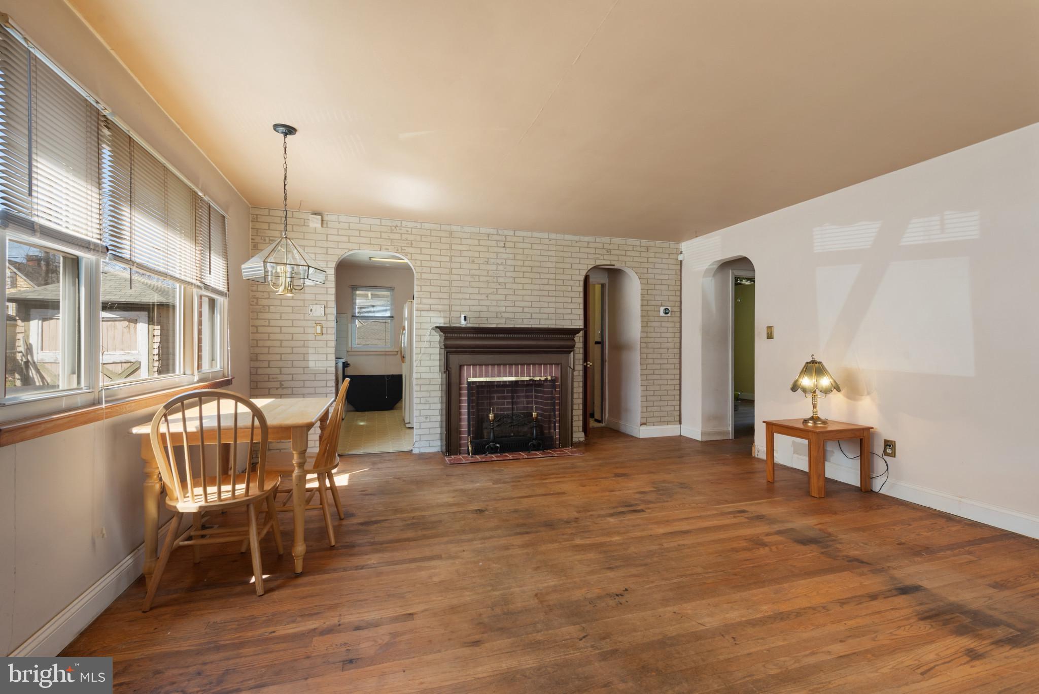 5016 Morello Road Baltimore, MD 21214 - Photo 3 of 16 a view of a livingroom with furniture and a fireplace