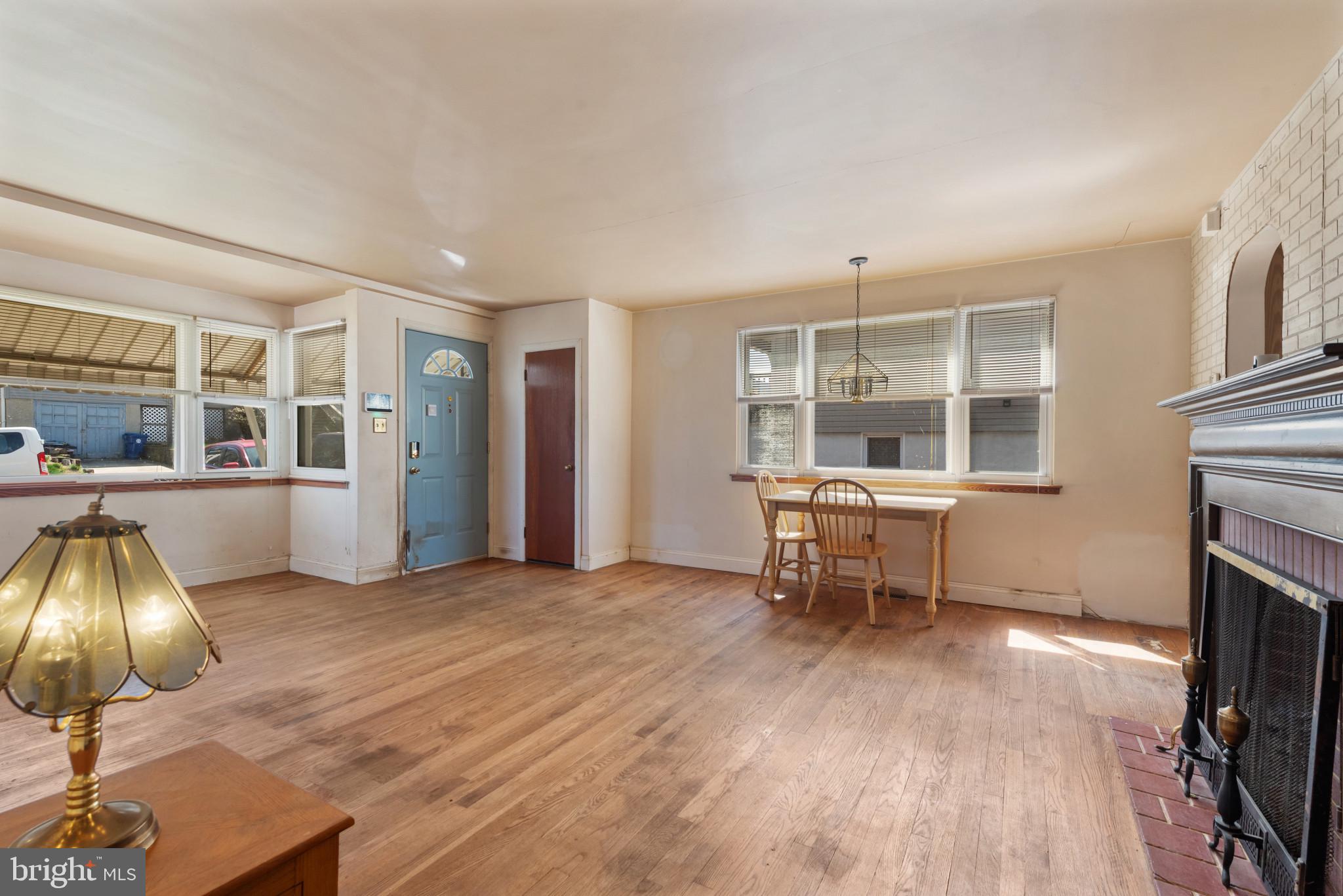 5016 Morello Road Baltimore, MD 21214 - Photo 5 of 16 a living room with furniture and a fireplace