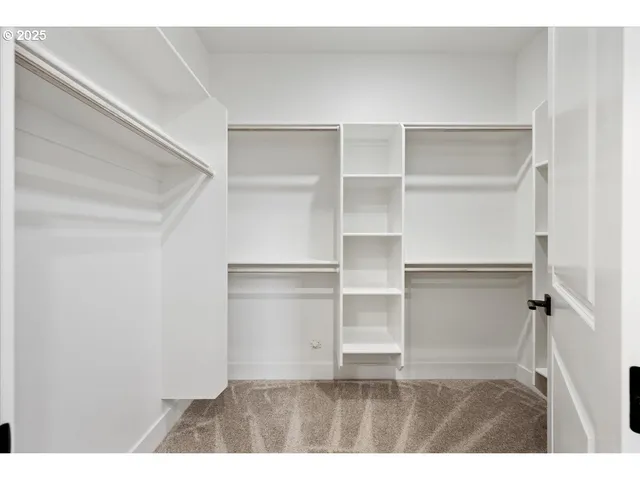 a view of an empty walk in closet