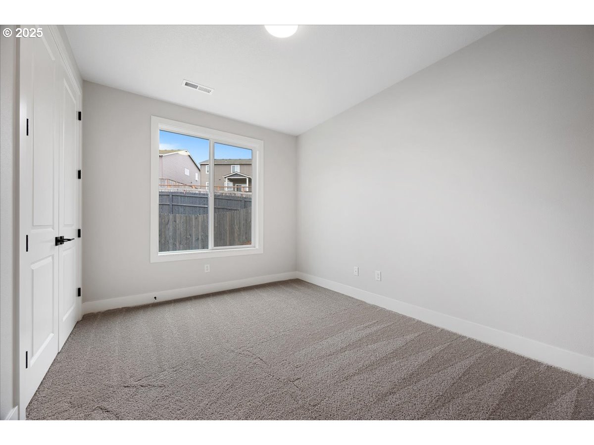 3517 North 11th Circle Ridgefield, WA 98642 - Photo 26 of 44 a view of an empty room with a window