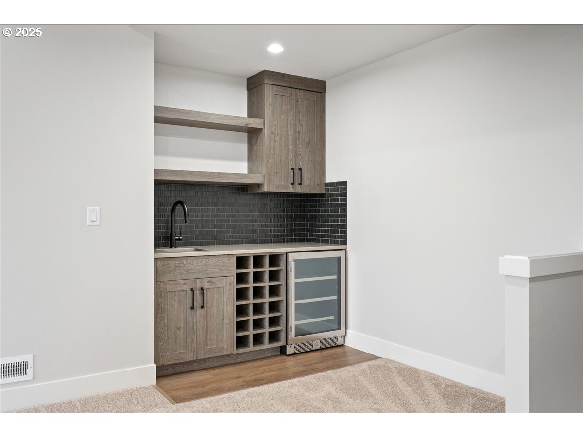3517 North 11th Circle Ridgefield, WA 98642 - Photo 31 of 44 a view of kitchen with granite countertop a sink and a stove