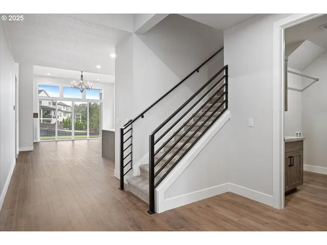 a view interior of a house wooden floor stairs and windows