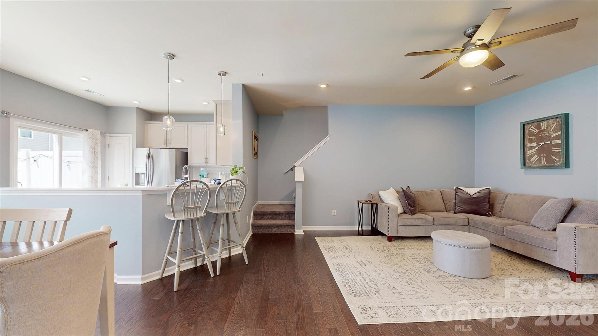 827 Canoe Song Road Fort Mill, SC 29708 - Photo 7 of 33 a living room with furniture and a wooden floor