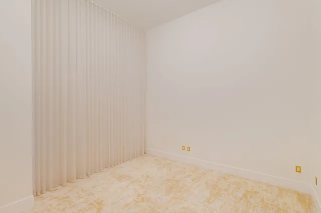 a kitchen with kitchen island granite countertop stainless steel appliances a refrigerator and a stove top oven