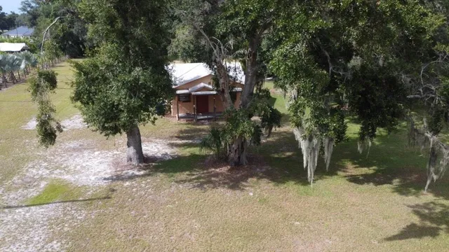 a view of a house with a tree