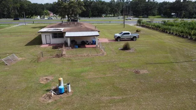 a view of a swimming pool with a patio