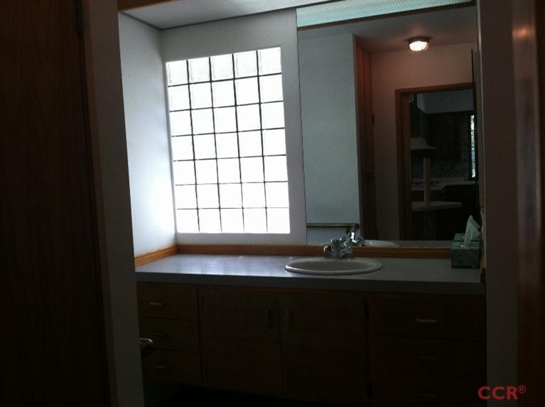 1569 Sycamore Canyon Road Santa Barbara, CA 93108 - Photo 11 of 25 a bathroom with a sink and a window