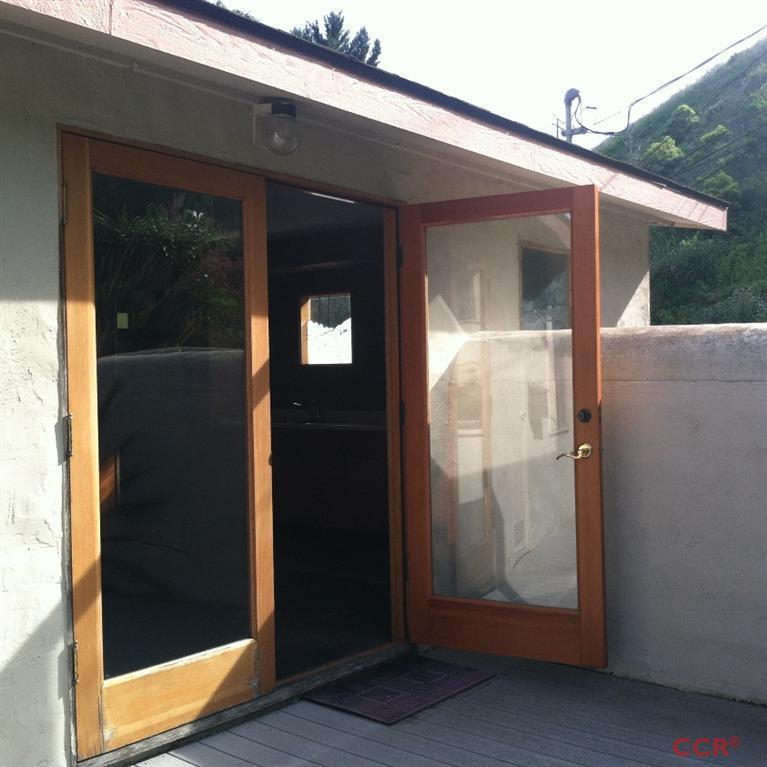 1569 Sycamore Canyon Road Santa Barbara, CA 93108 - Photo 19 of 25 a view of a glass door of the house