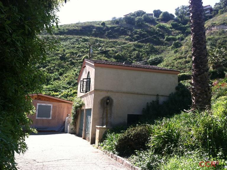 1569 Sycamore Canyon Road Santa Barbara, CA 93108 - Photo 5 of 25 a view of a house with a tree in the background