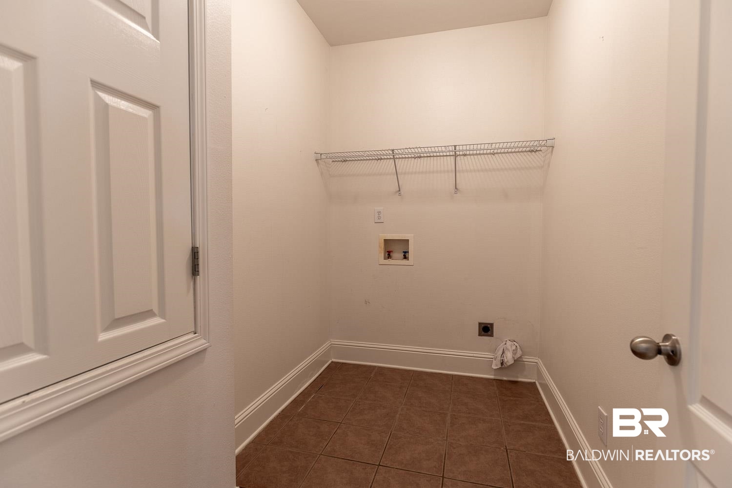 101 Normandy Street Fairhope, AL 36532 - Photo 16 of 18 Laundry room featuring hookup for a washing machine, dark tile patterned flooring, and electric dryer hookup