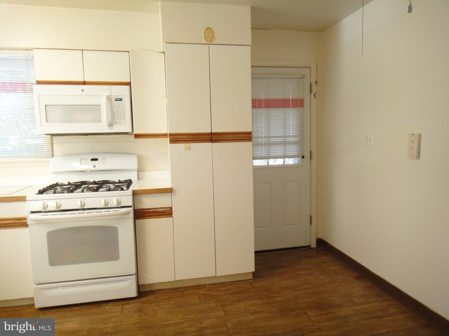 823 Suffolk Road Jenkintown, PA 19046 - Photo 8 of 19 a kitchen with a stove and a white refrigerator
