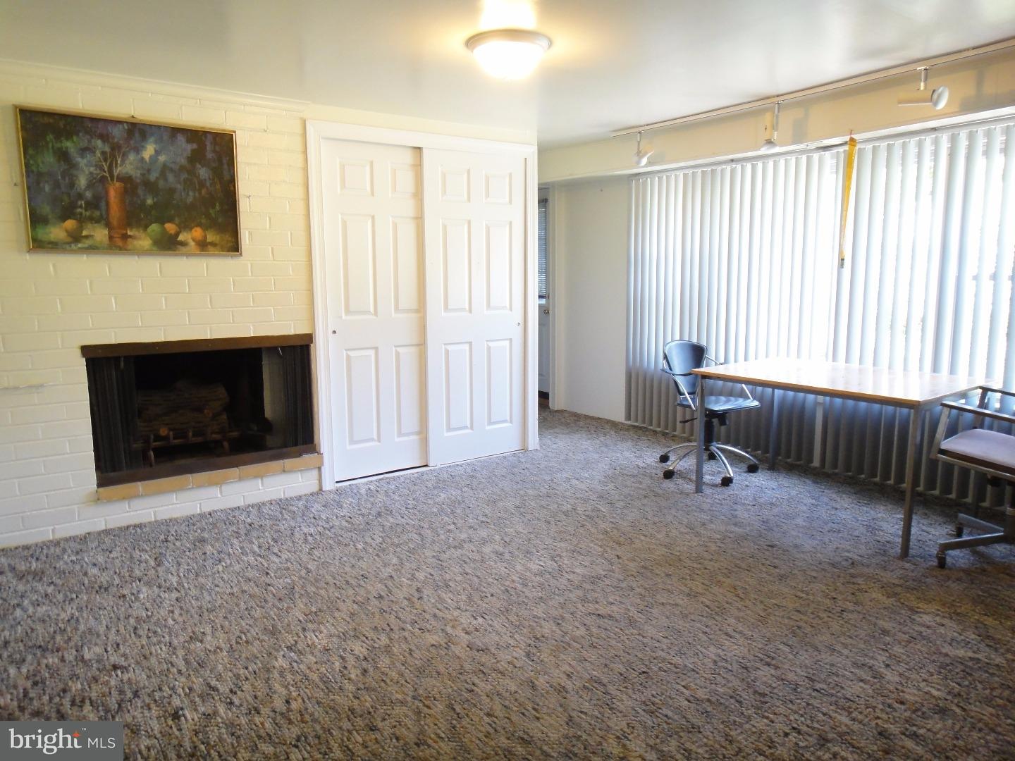 823 Suffolk Road Jenkintown, PA 19046 - Photo 9 of 19 a view of a livingroom with furniture and a fireplace