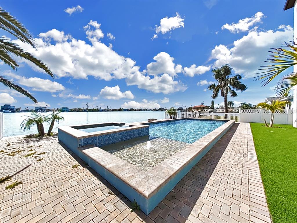 882 Bay Point Drive Madeira Beach, FL 33708 - Photo 65 of 73 a view of a house with swimming pool