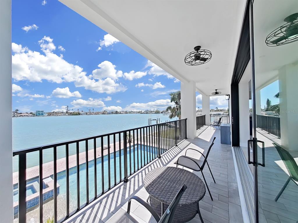 882 Bay Point Drive Madeira Beach, FL 33708 - Photo 72 of 73 a view of a balcony with furniture