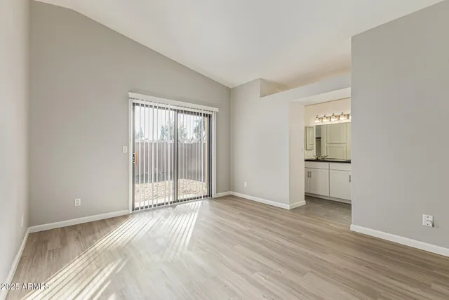 a kitchen with stainless steel appliances a stove a microwave and cabinets