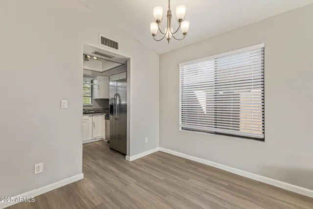 a view of a room with a windows and wooden floor