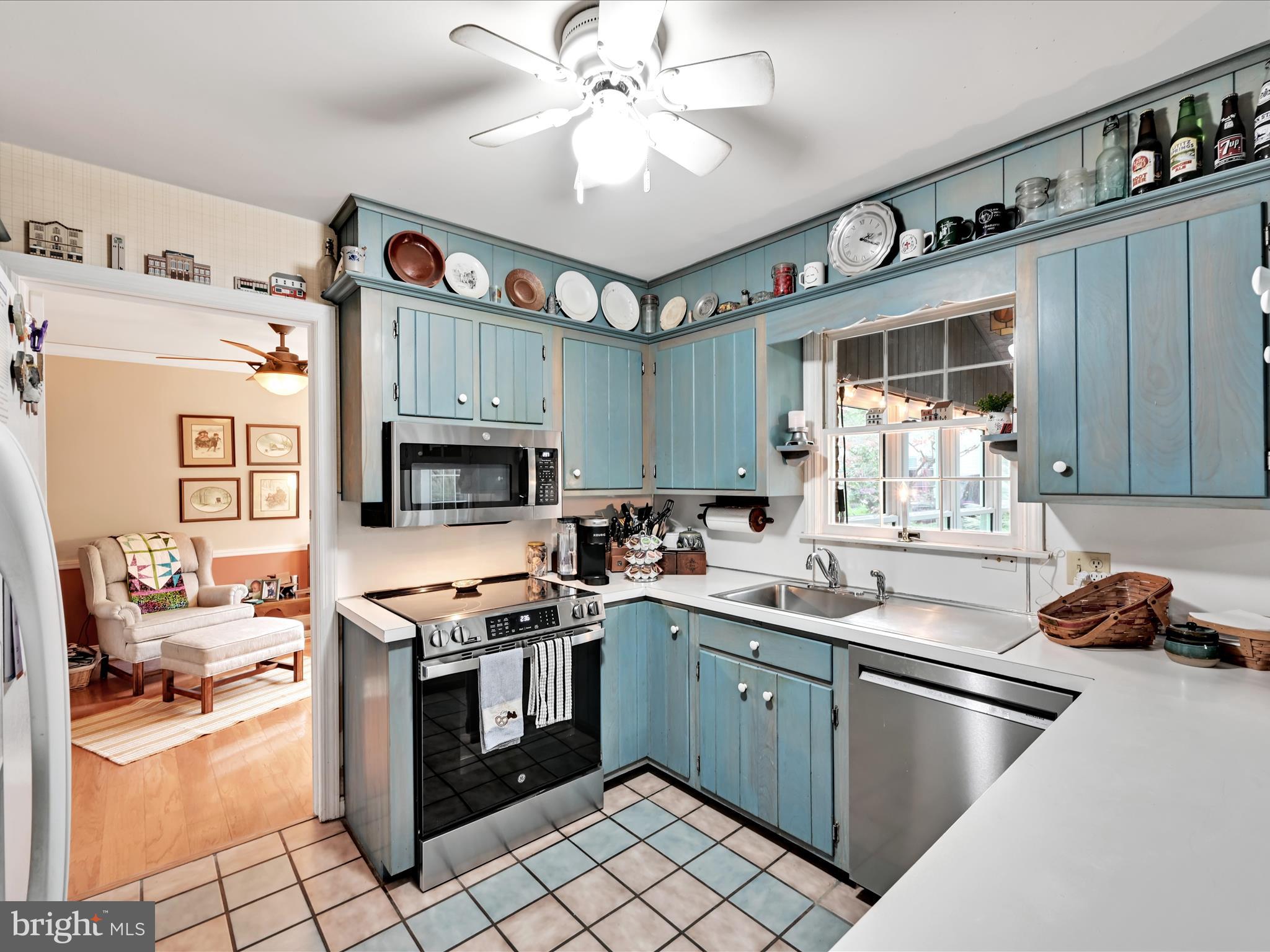 618 West 3rd Avenue Lititz, PA 17543 - Photo 11 of 40 a kitchen with stainless steel appliances a stove sink and cabinets