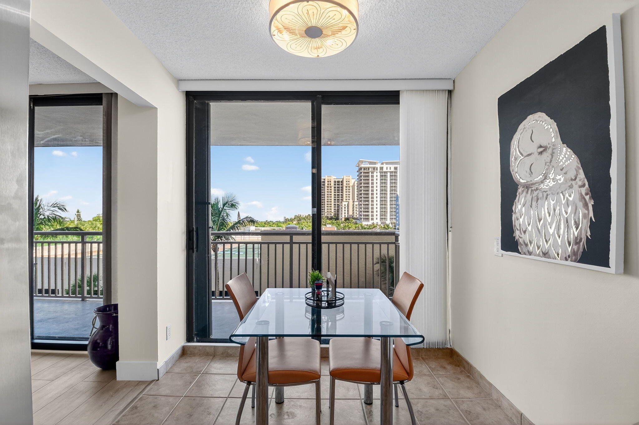 3400 North Ocean Drive, Unit 405 Riviera Beach, FL 33404 - Photo 14 of 58 a view of a balcony with furniture and wooden floor