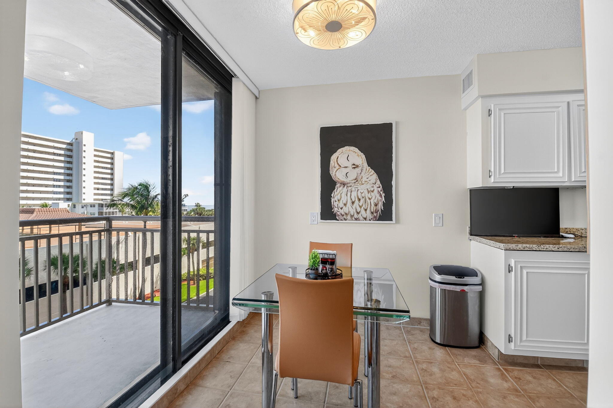 3400 North Ocean Drive, Unit 405 Riviera Beach, FL 33404 - Photo 15 of 58 a living room with furniture and a flat screen tv
