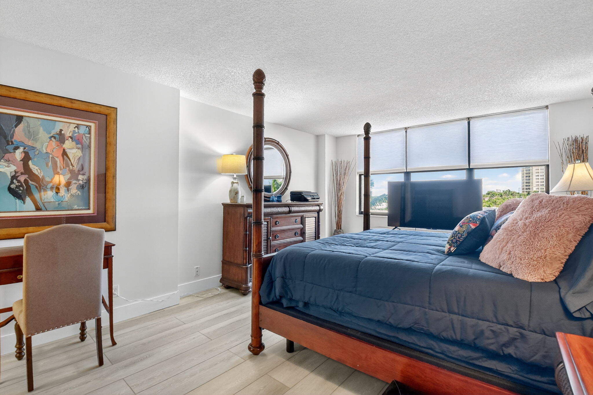3400 North Ocean Drive, Unit 405 Riviera Beach, FL 33404 - Photo 18 of 58 a bedroom with a bed and wooden floor
