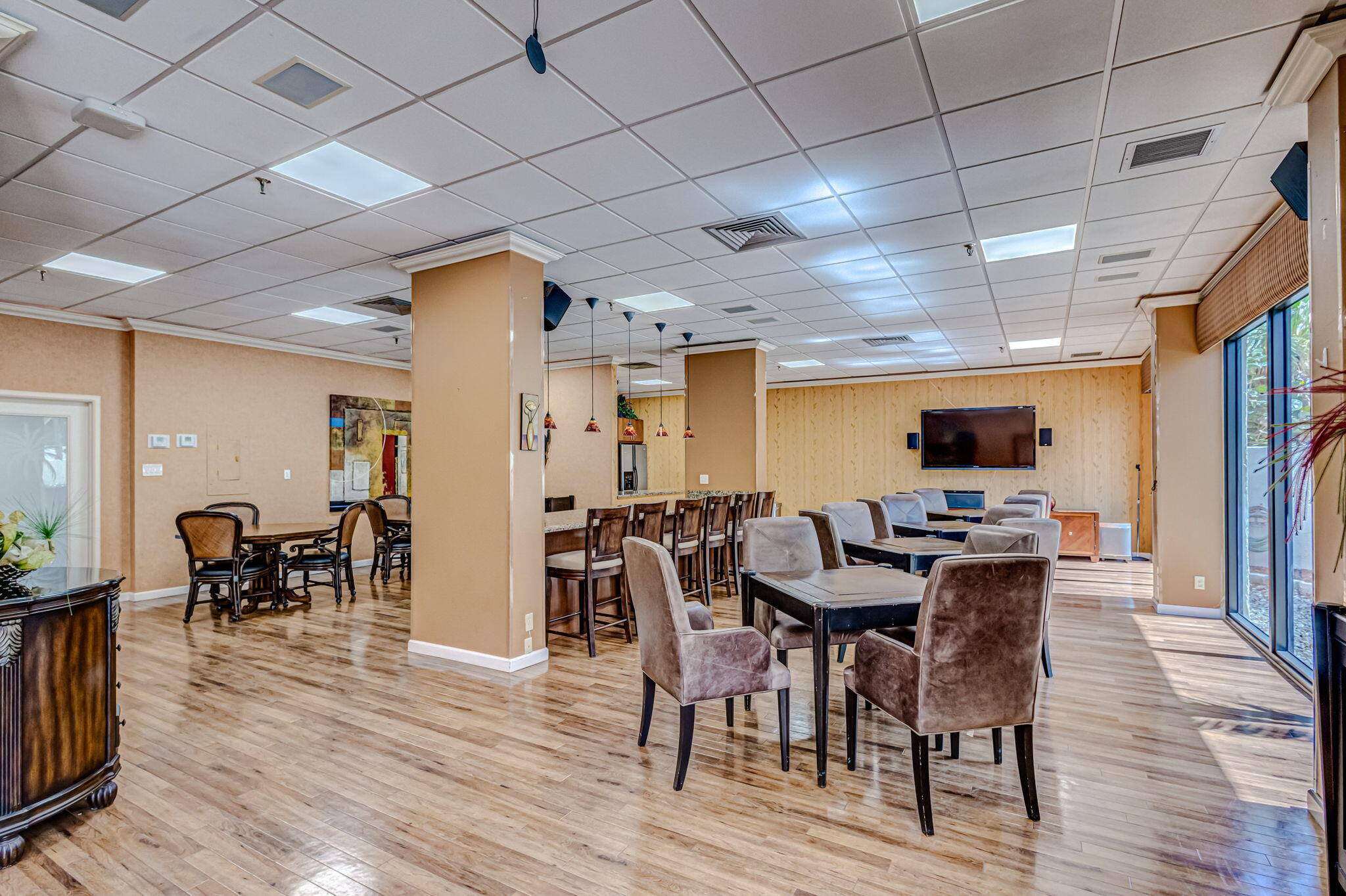 3400 North Ocean Drive, Unit 405 Riviera Beach, FL 33404 - Photo 36 of 58 a view of a dining room with furniture window and wooden floor