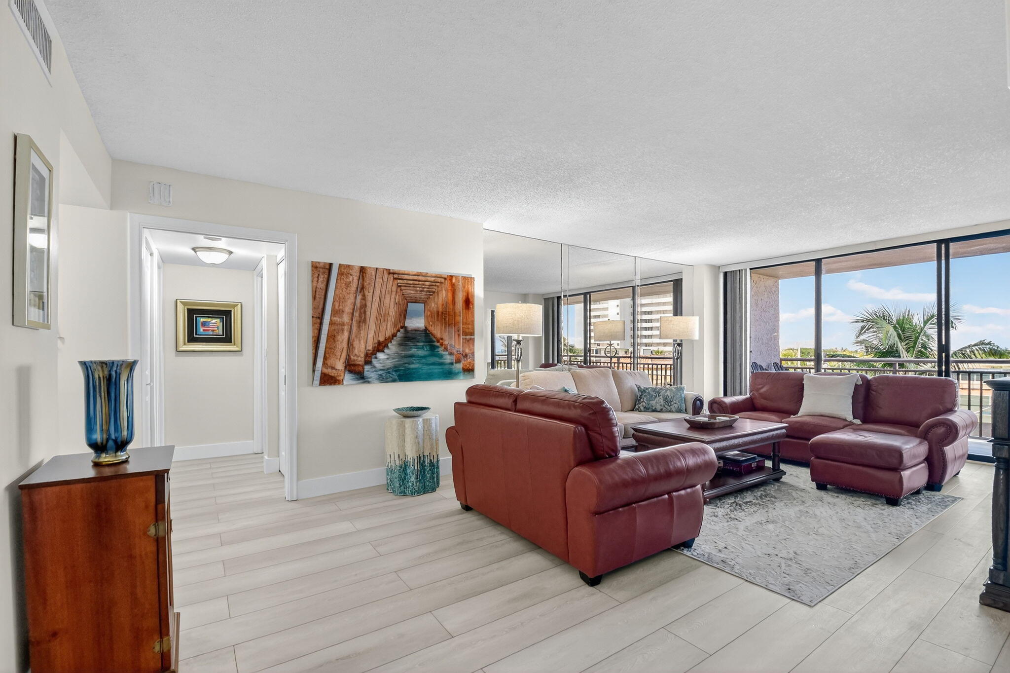 3400 North Ocean Drive, Unit 405 Riviera Beach, FL 33404 - Photo 4 of 58 a living room with furniture and a large window