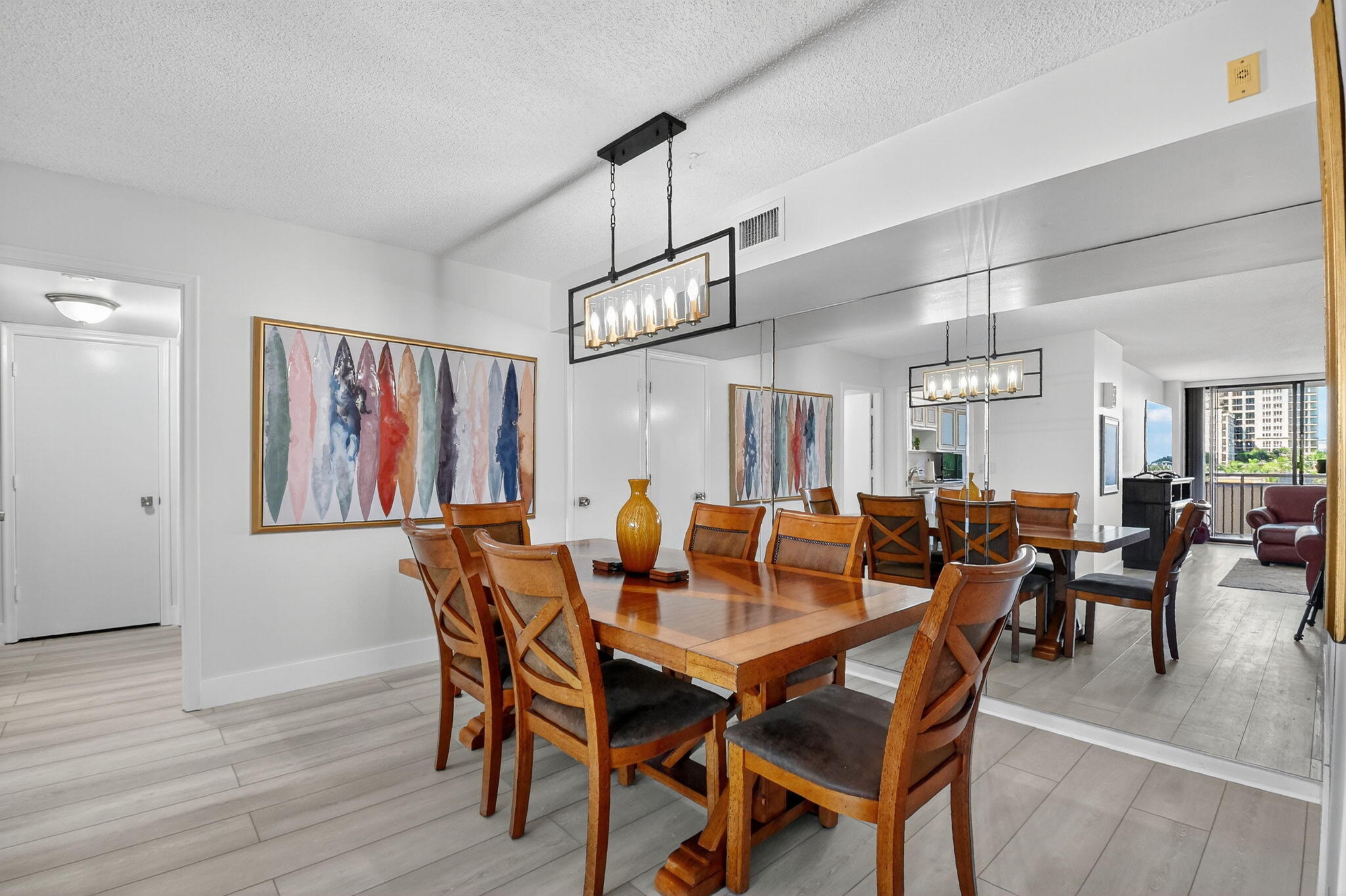 3400 North Ocean Drive, Unit 405 Riviera Beach, FL 33404 - Photo 9 of 58 a view of a dining room with furniture window and wooden floor
