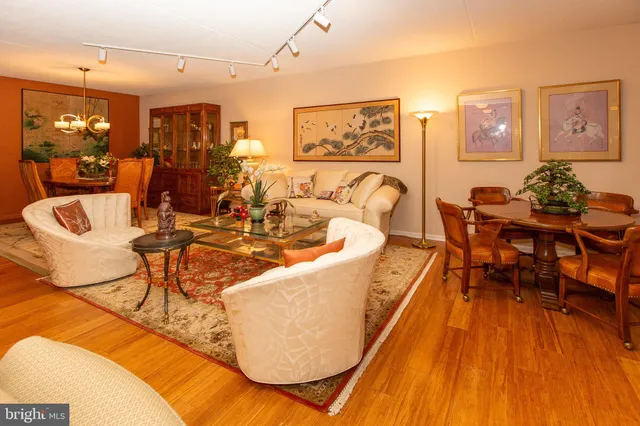 a bed sitting in a bedroom next to a window with dresser