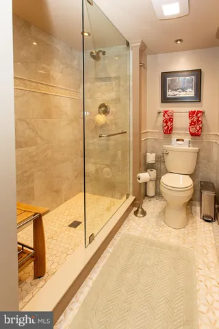 a large bedroom with a bed and window