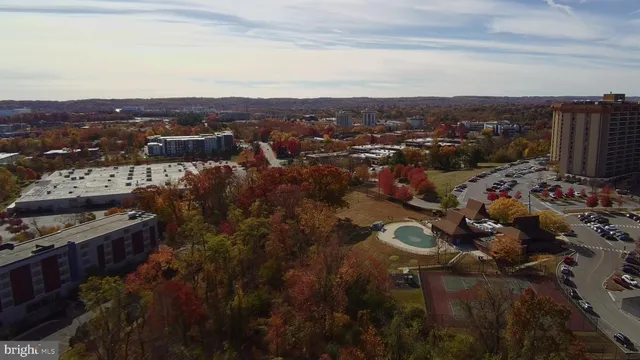 a view of a balcony with chairs potted plants