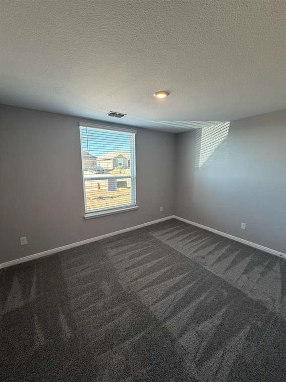 8008 Ravalli Street Ponder, TX 76259 - Photo 5 of 12 an empty room with a window
