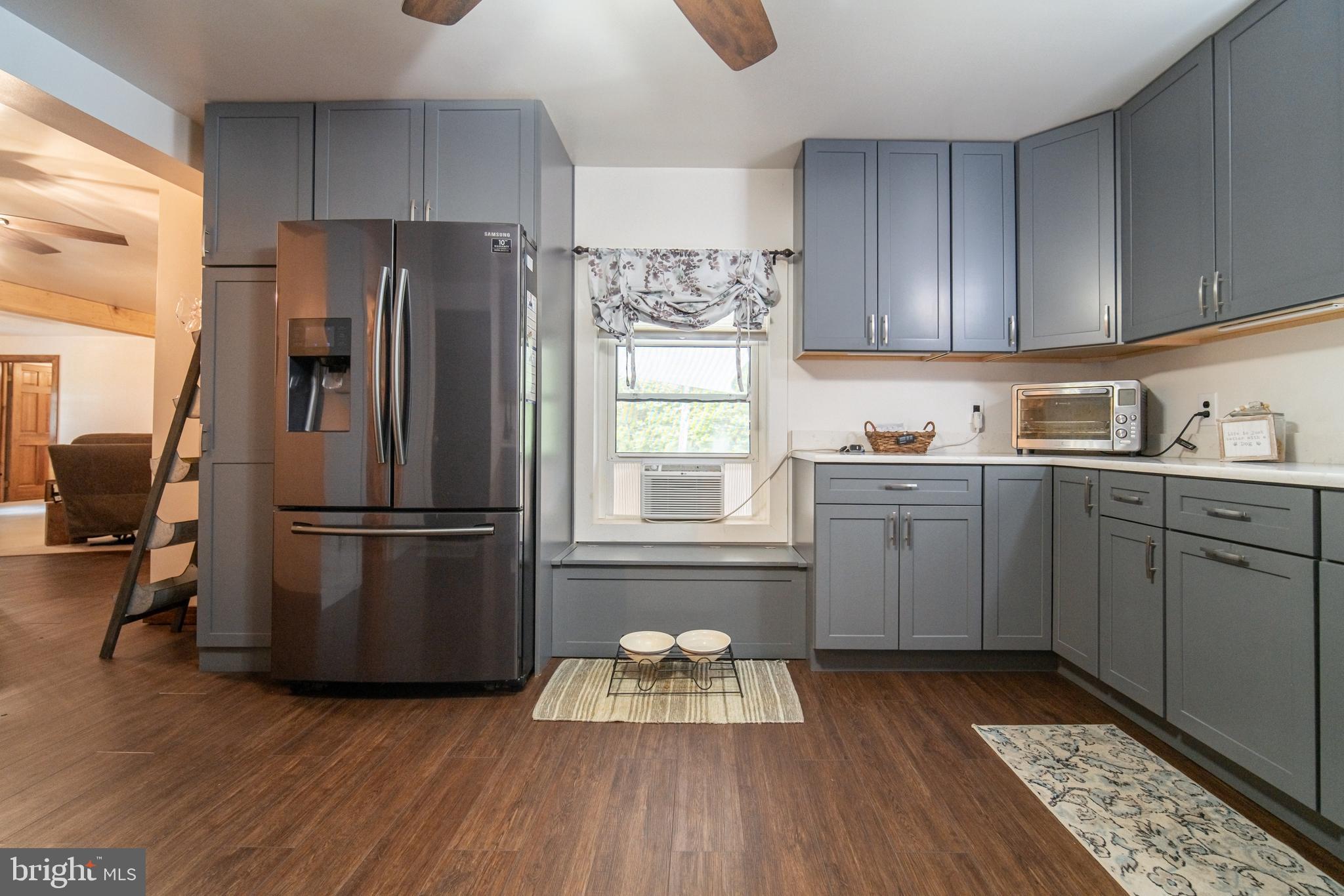 13127 Manor Furnace Road Brogue, PA 17309 - Photo 24 of 78 a kitchen with a refrigerator a sink and wooden cabinets