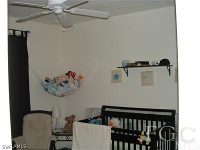 8632 Stringfellow Road St. James City, FL 33956 - Photo 4 of 10 a view of a hallway with a dining table and chairs