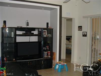 8632 Stringfellow Road St. James City, FL 33956 - Photo 8 of 10 a room with furniture and mirror